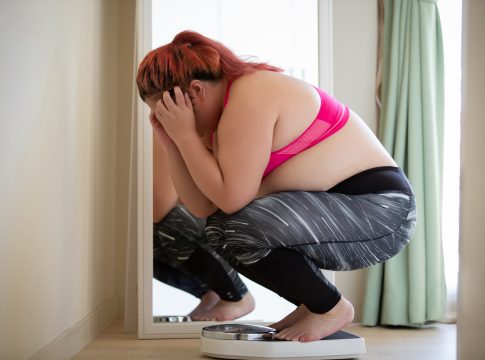 plus size sport woman feel upset about obesity in her sportswear