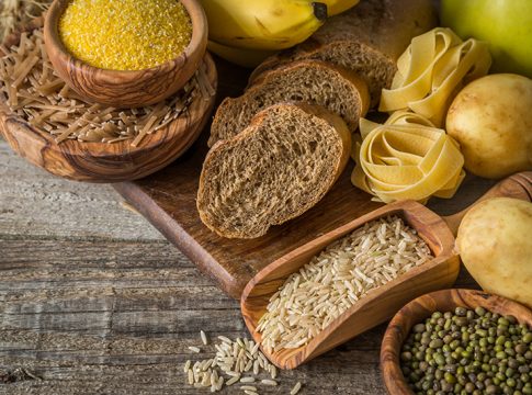 Selection of comptex carbohydrates sources on wood background, copy space