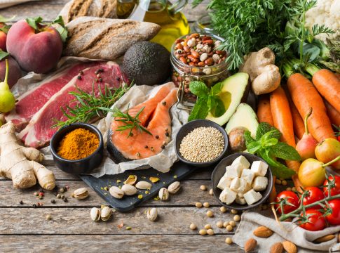 Balanced nutrition concept for clean eating flexitarian mediterranean diet. Assortment of healthy food ingredients for cooking on a wooden kitchen table.