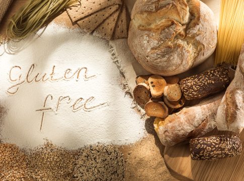 Gluten free food. Various pasta, bread and snacks on wooden background from top view. Healthy and diet concept.
