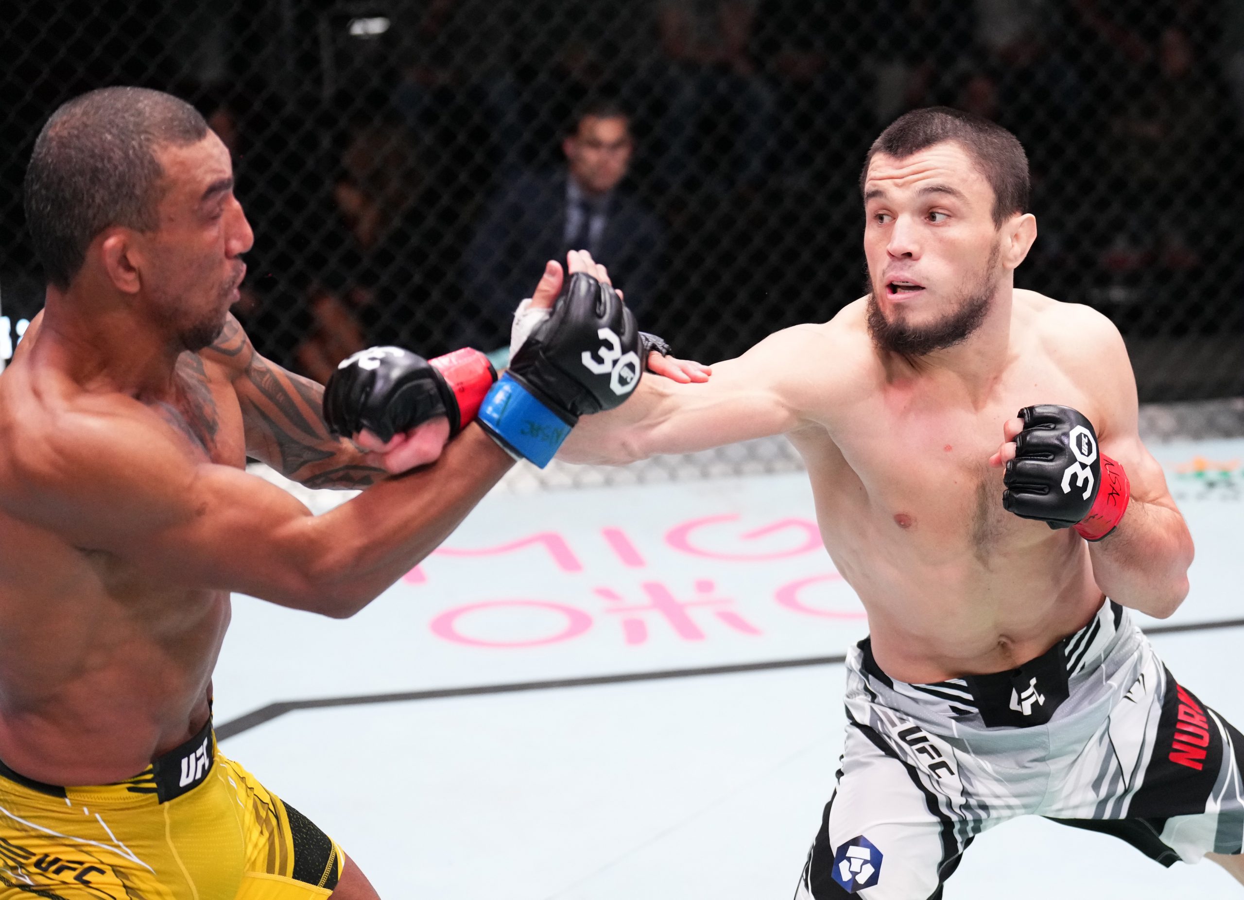 LAS VEGAS, NEVADA - JANUARY 14: (R-L) Umar Nurmagomedov of Russia punches Raoni Barcelos of Brazil in a bantamweight fight during the UFC Fight Night event at UFC APEX on January 14, 2023 in Las Vegas, Nevada. (Photo by Chris Unger/Zuffa LLC via Getty Images)